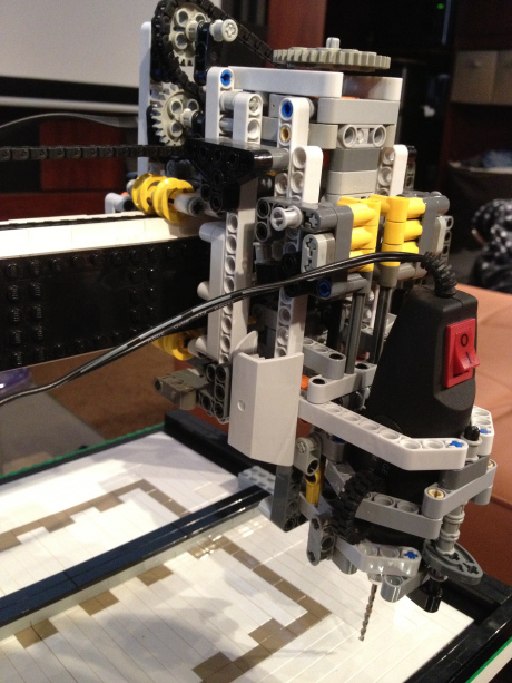 A close view of the Lego gear train and chain drive on one axis