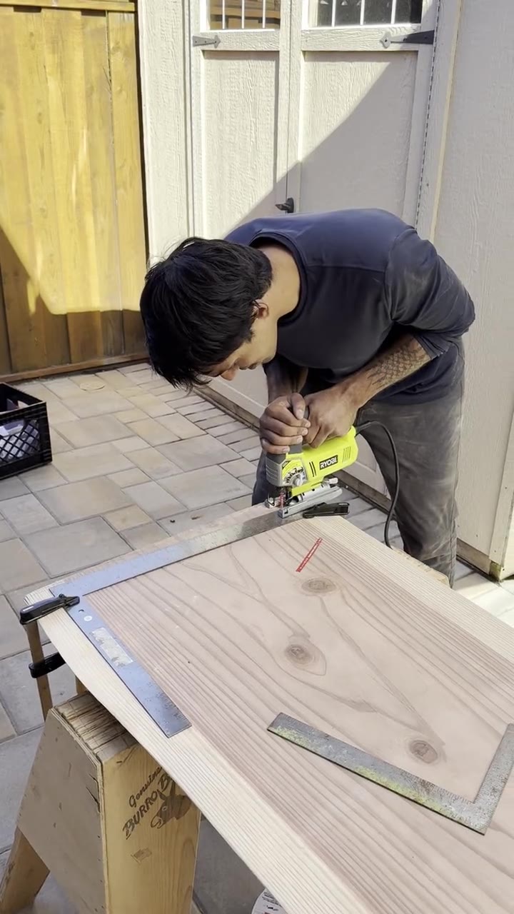 Cutting the slab to length with a jigsaw guided by a clamped framing square