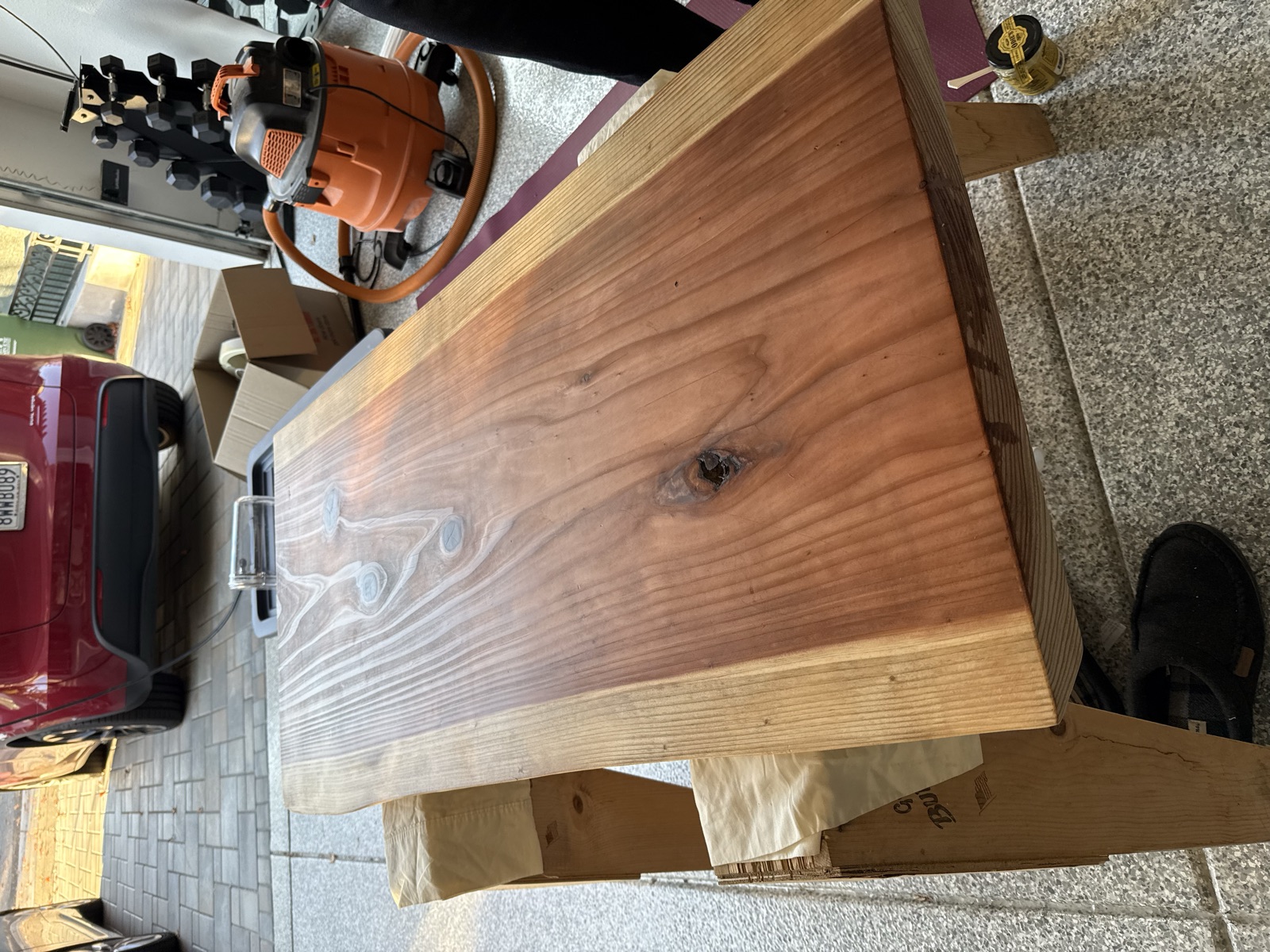 The underside of the slab after oiling, still on sawhorses in the garage