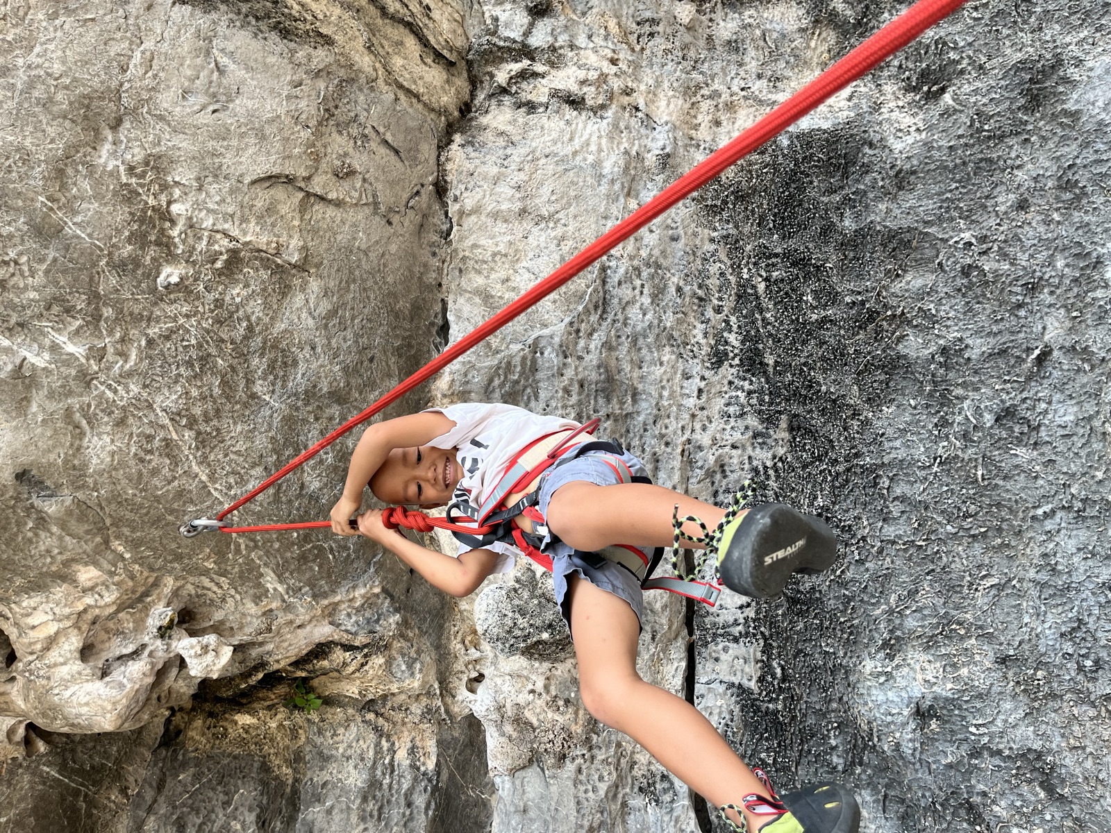 Fadeo giving a fist bump to a climber